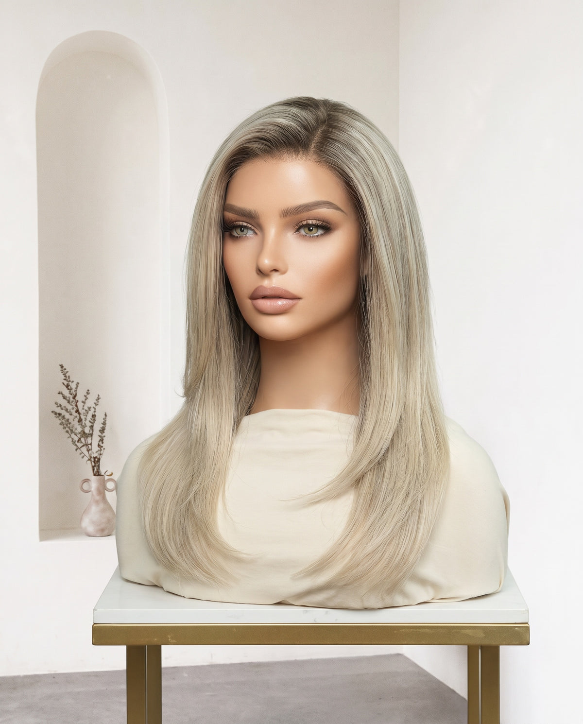 Noor ash blonde layered wig on a display stand