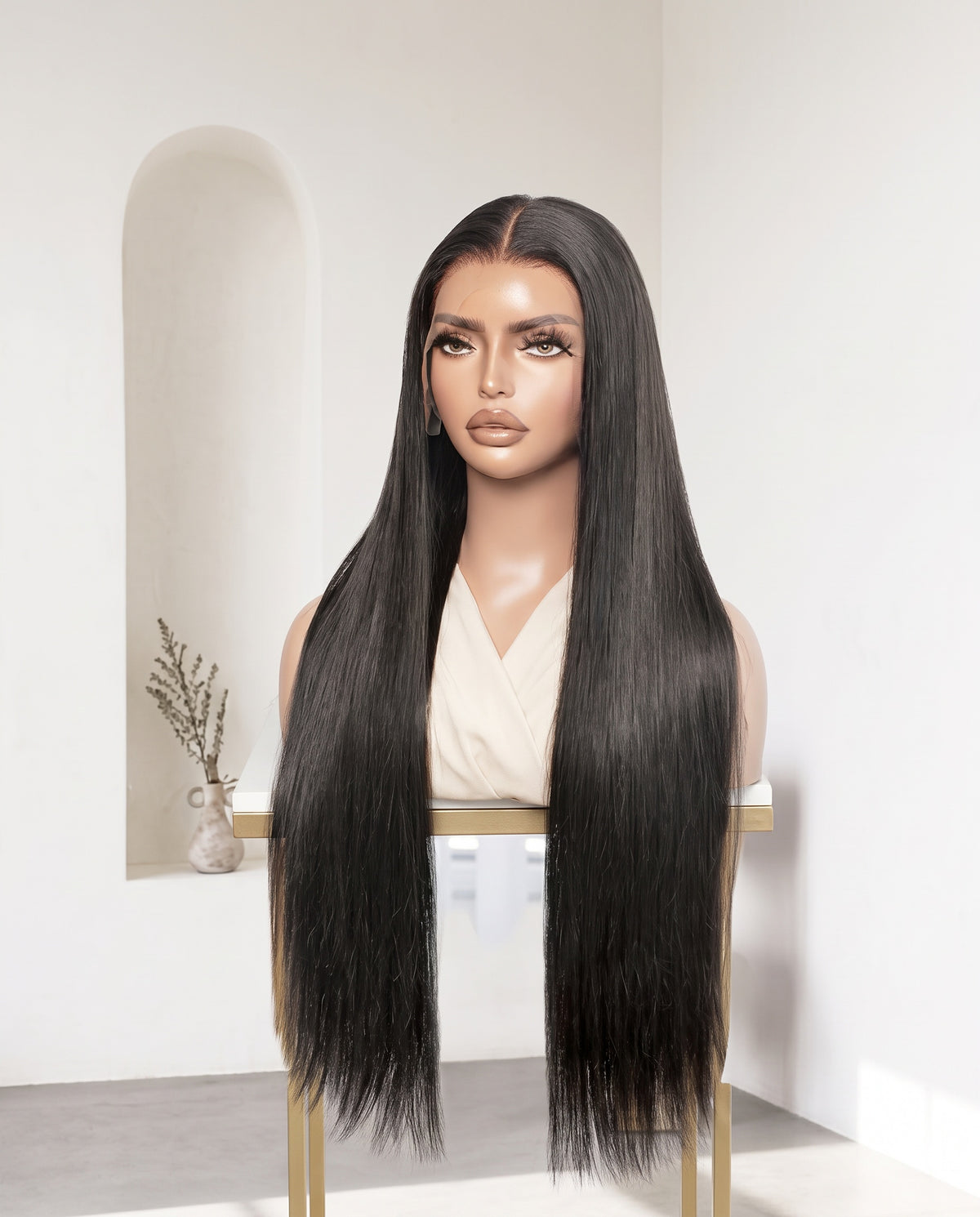 Layla natural black bone straight 30 inch wig on a display stand