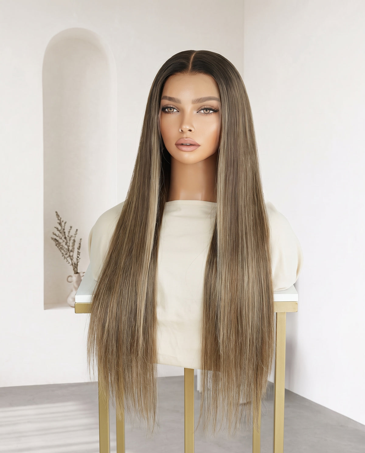 Celine bronde balayage straight wig on a display stand