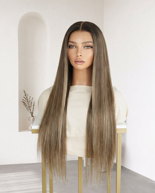 Celine bronde balayage straight wig on a display stand