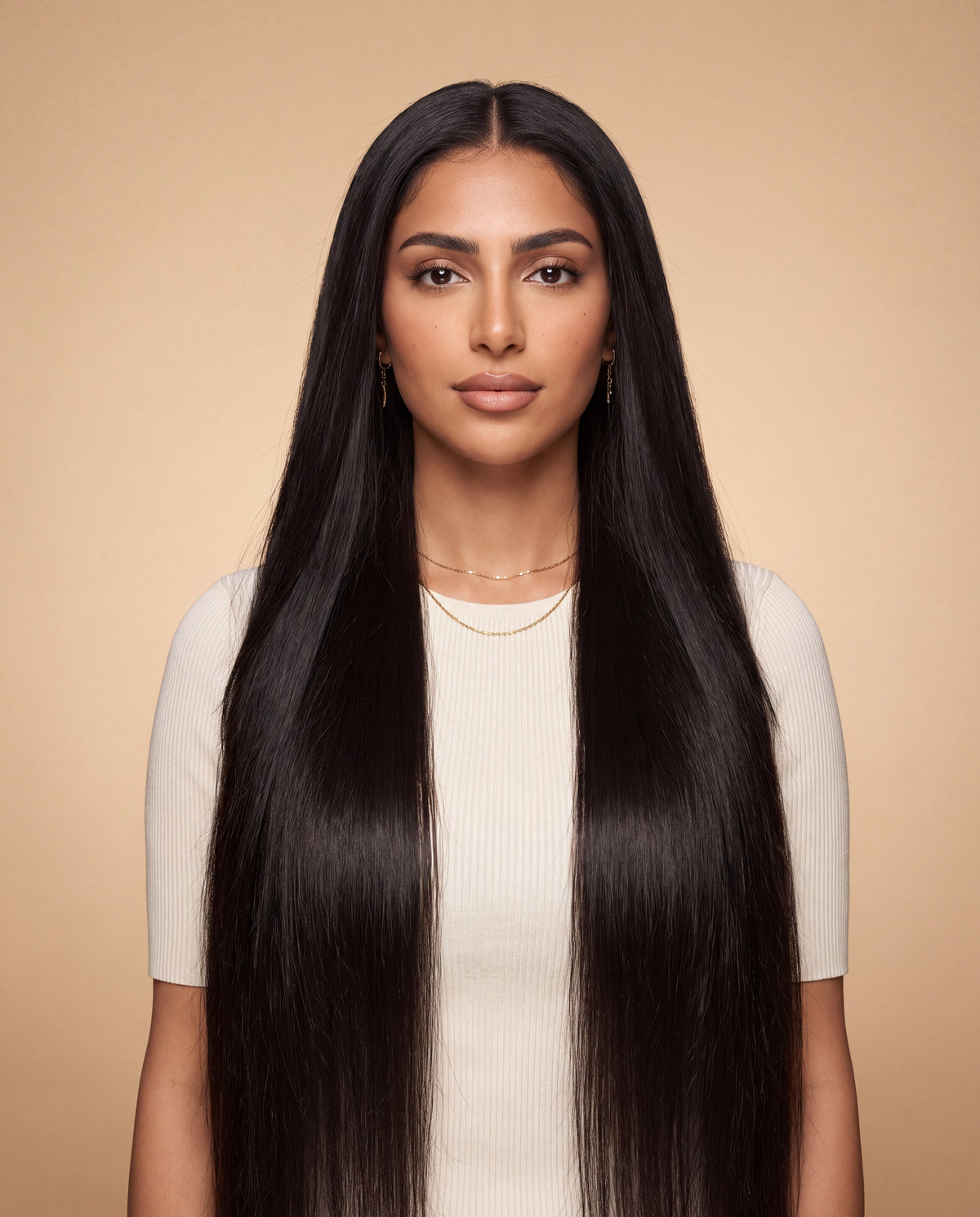 Model wearing the Layla natural black bone straight 30 inch wig