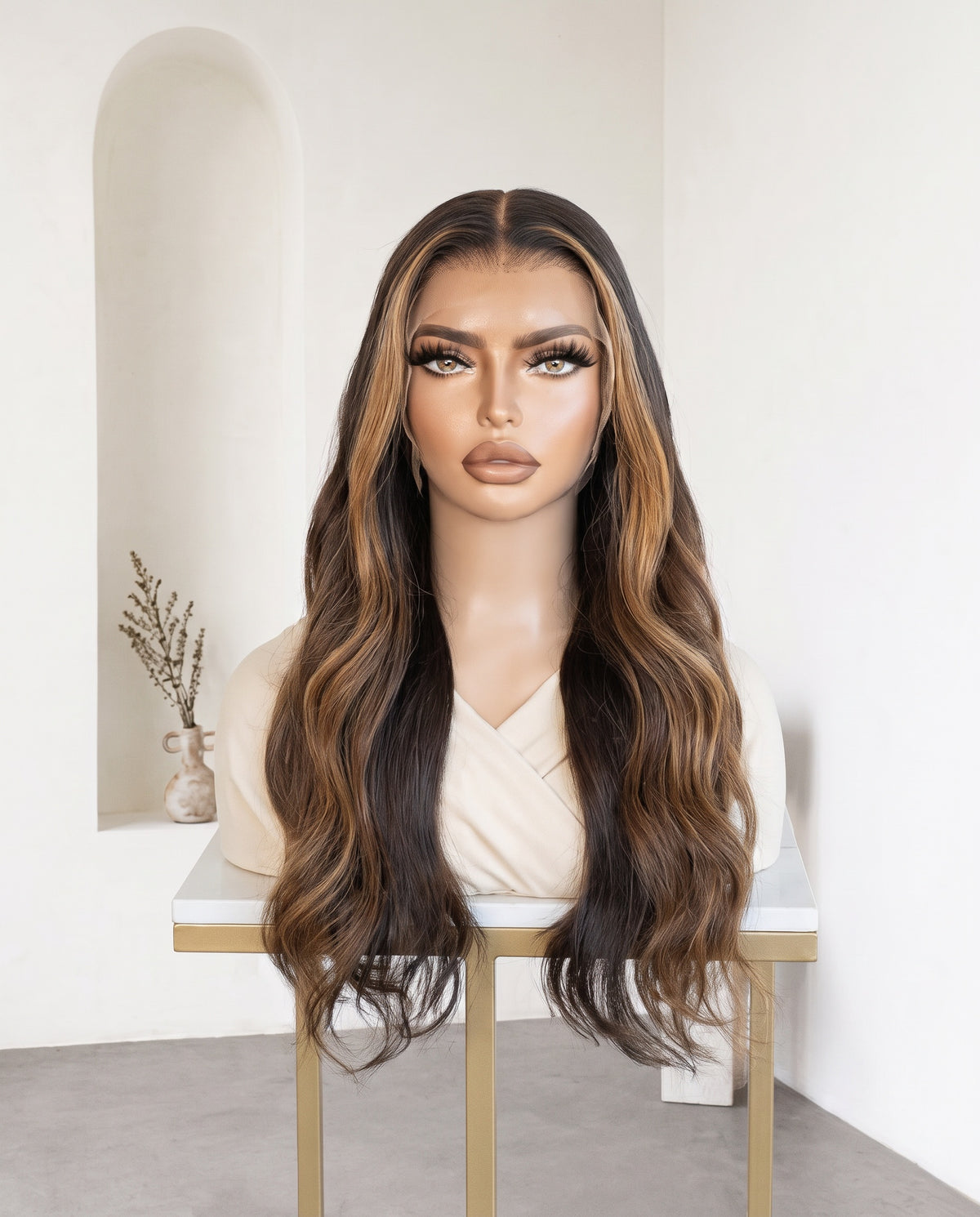 Valentina caramel balayage body wave wig on a display stand